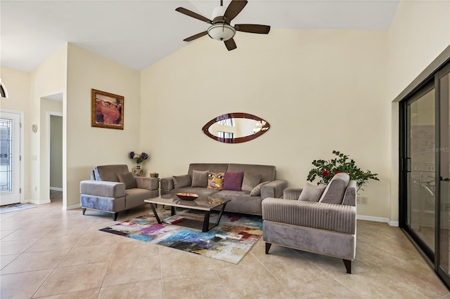 living room featuring high vaulted ceiling, ceiling fan, and light tile patterned floors