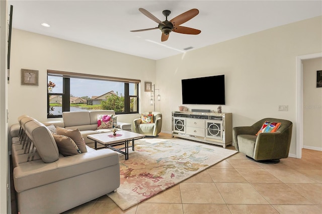 tiled living room featuring ceiling fan