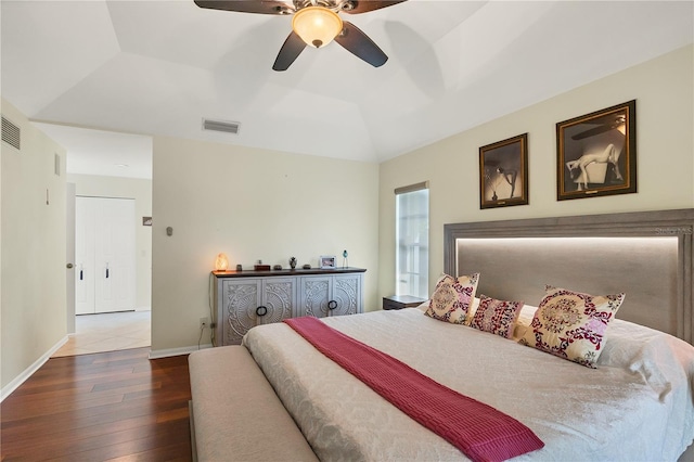 bedroom with lofted ceiling, hardwood / wood-style floors, and ceiling fan