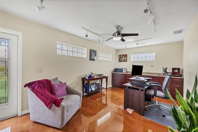 home office featuring rail lighting and ceiling fan