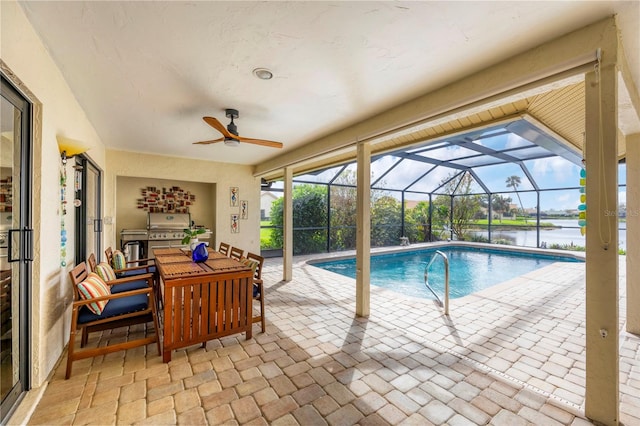 view of swimming pool featuring a water view, ceiling fan, a patio, a lanai, and area for grilling