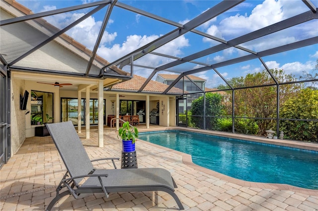 view of pool featuring a patio, a lanai, and ceiling fan