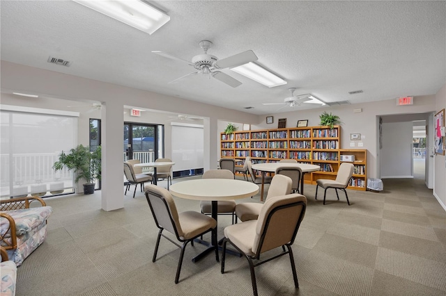 dining space featuring a textured ceiling