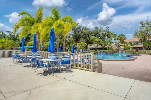 view of swimming pool with a patio area