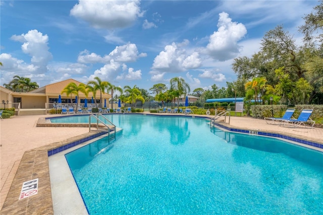 view of pool featuring a patio