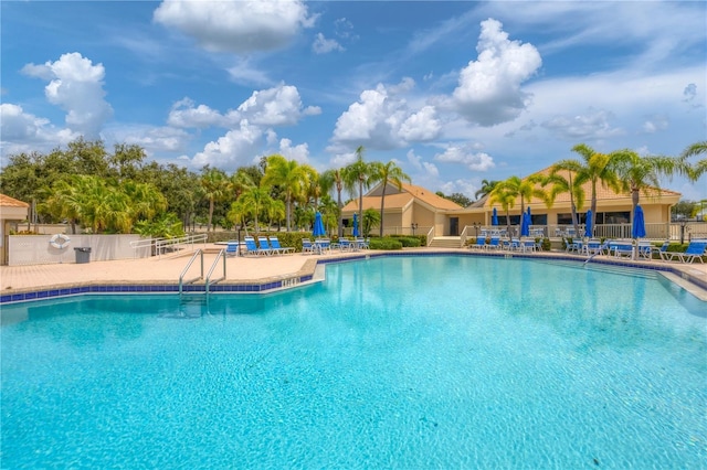 view of pool featuring a patio