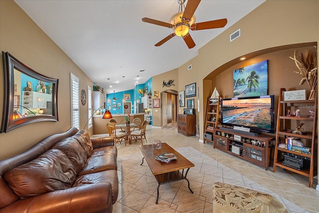 tiled living room featuring ceiling fan