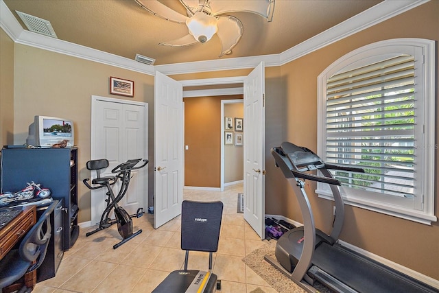 workout area with ornamental molding, a textured ceiling, light tile patterned floors, and ceiling fan