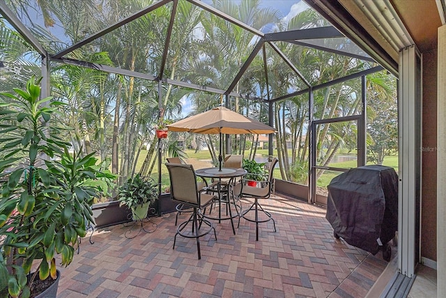 view of patio featuring a lanai and area for grilling