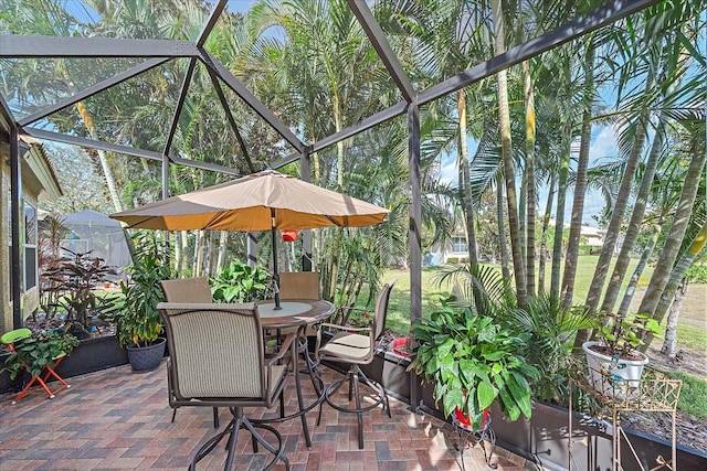 view of patio with glass enclosure