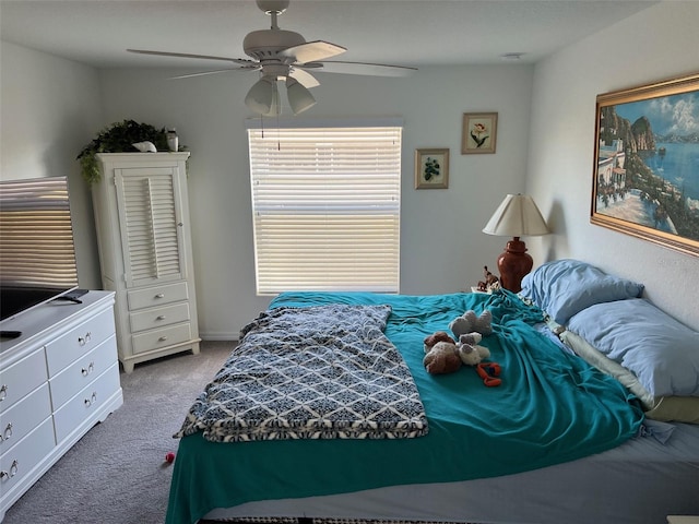 bedroom featuring ceiling fan and carpet flooring