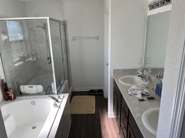 full bathroom featuring toilet, vanity, shower with separate bathtub, and hardwood / wood-style floors