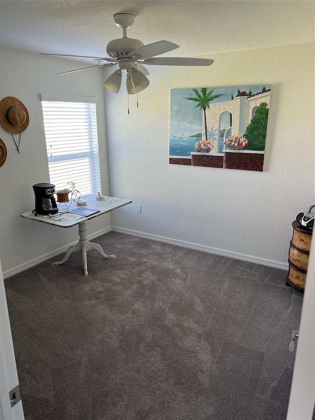 carpeted home office with ceiling fan