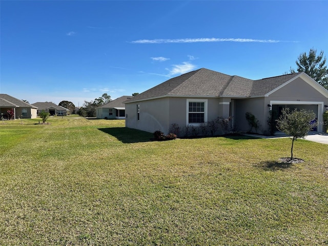 view of property exterior featuring a lawn and a garage