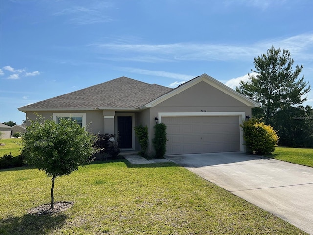 ranch-style house with a front yard and a garage