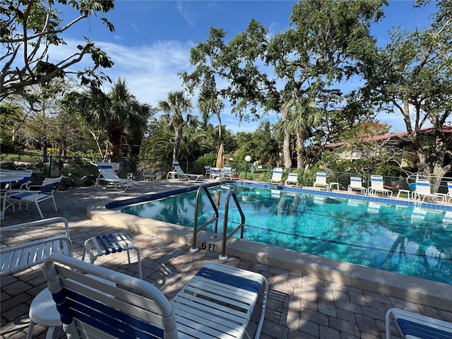 view of swimming pool with a patio