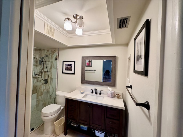 bathroom featuring tile patterned flooring, vanity, toilet, and a tile shower