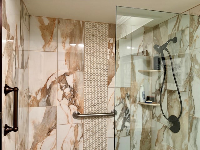 bathroom featuring an enclosed shower and tile walls