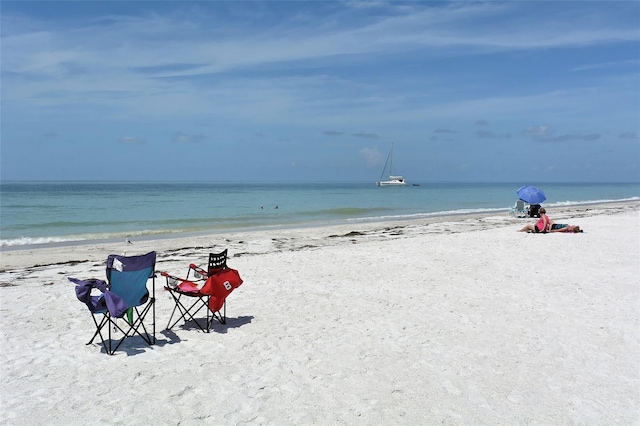 property view of water featuring a beach view