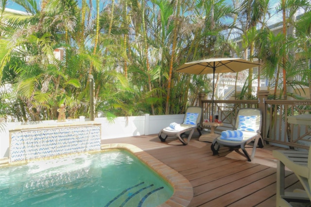 view of swimming pool with a deck