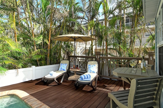 wooden deck featuring a pool