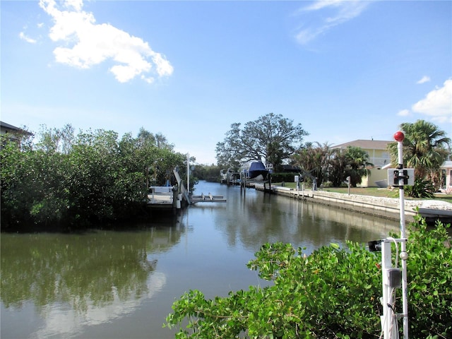 property view of water featuring a boat dock and boat lift