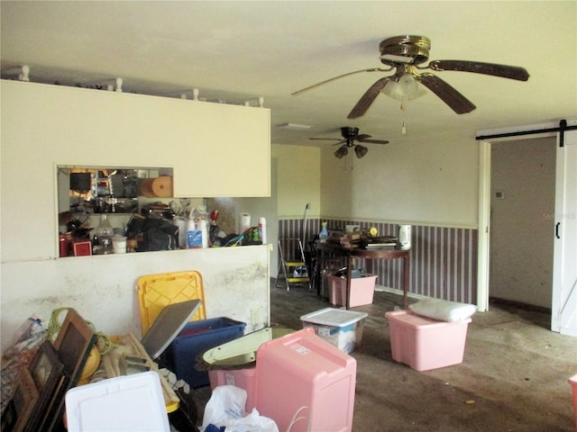 interior space featuring concrete flooring and a barn door