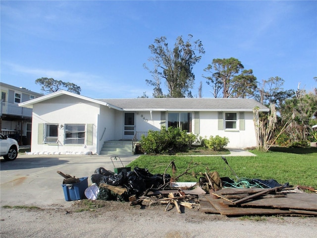 ranch-style house with a front yard