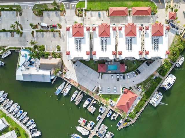 birds eye view of property with a water view