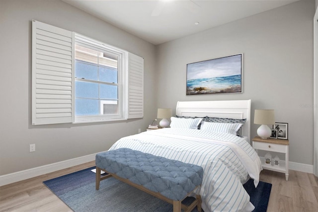 bedroom featuring ceiling fan and light hardwood / wood-style flooring