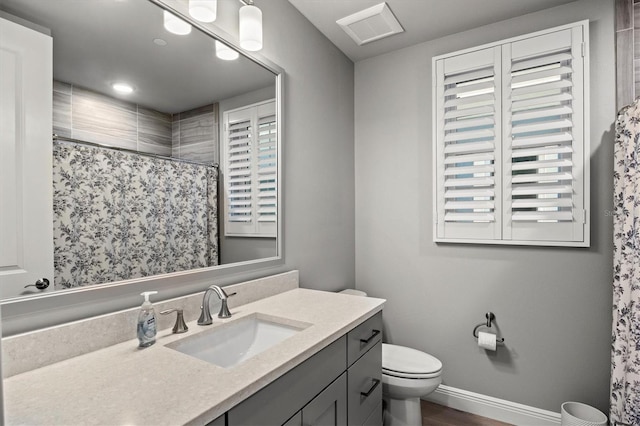 bathroom with toilet, vanity, wood-type flooring, and curtained shower