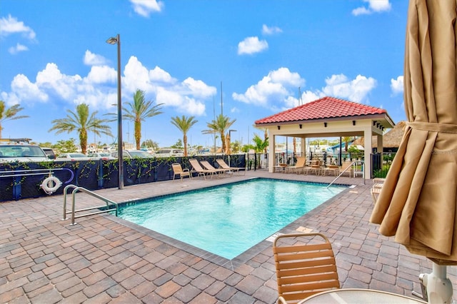 view of swimming pool with a patio area