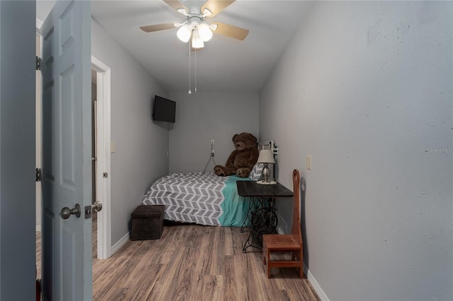 bedroom featuring hardwood / wood-style floors and ceiling fan