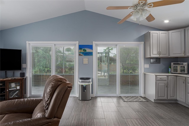 interior space with vaulted ceiling and ceiling fan