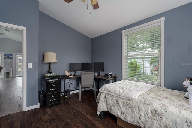 bedroom featuring ceiling fan, dark hardwood / wood-style flooring, and lofted ceiling