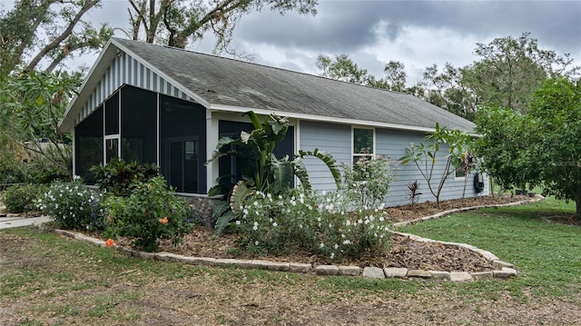 view of front of home with a sunroom