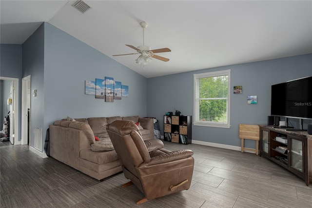 living room with lofted ceiling, wood-type flooring, and ceiling fan