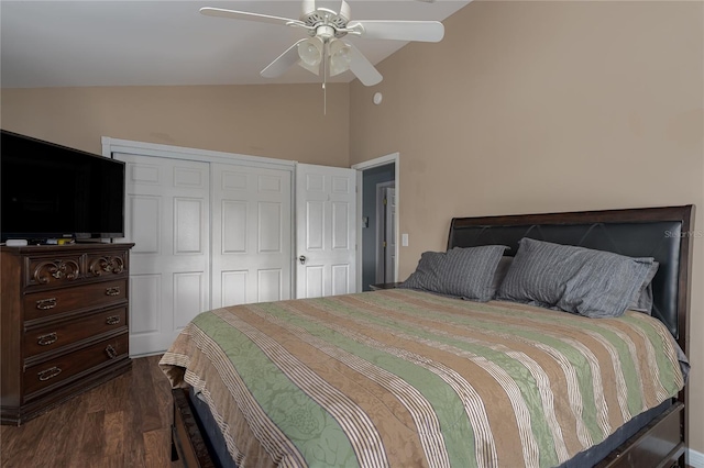 bedroom featuring lofted ceiling, dark hardwood / wood-style flooring, a closet, and ceiling fan