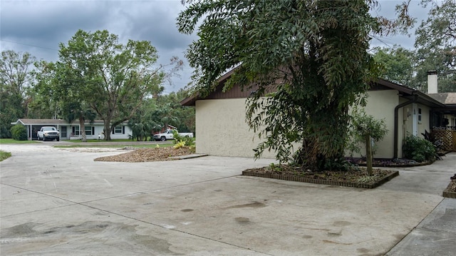 view of home's exterior with a carport