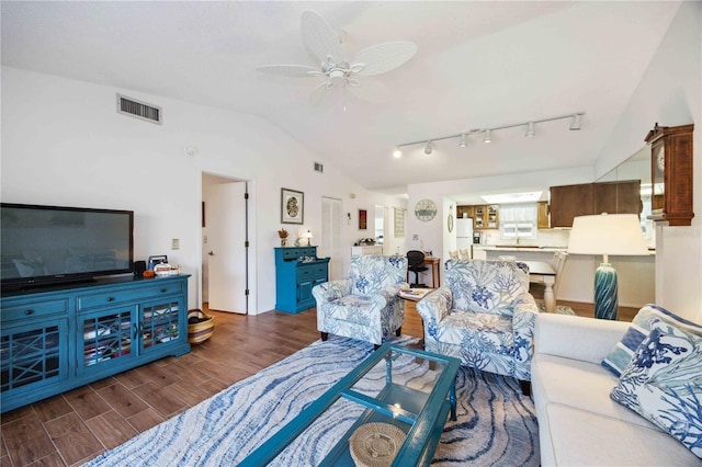 living room with wood finished floors, visible vents, lofted ceiling, ceiling fan, and rail lighting