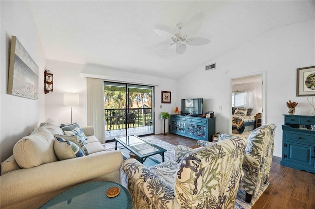 living area with plenty of natural light, wood finished floors, visible vents, and vaulted ceiling