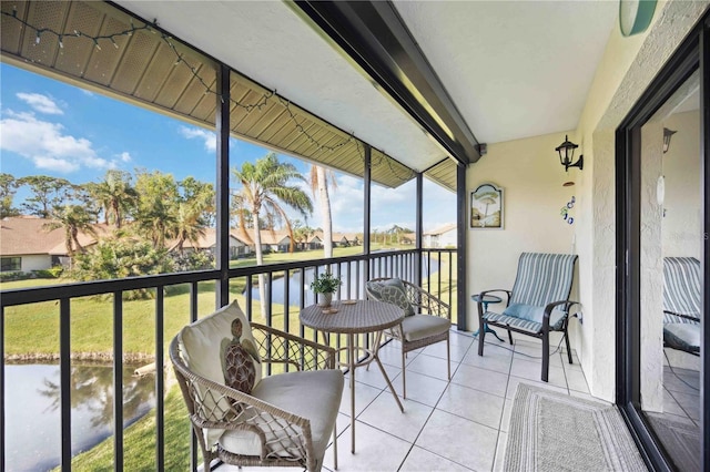 balcony featuring a water view