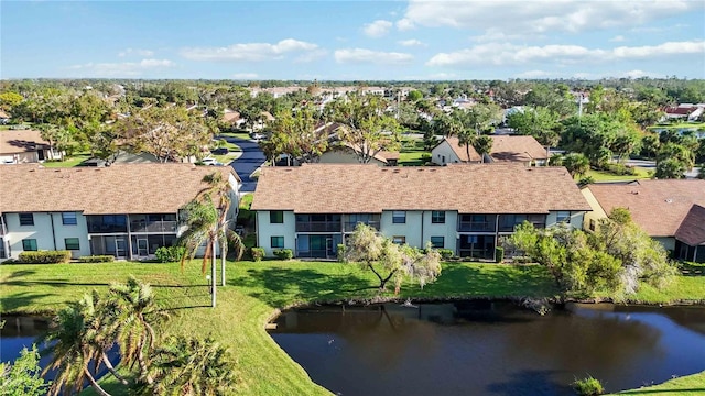 aerial view with a residential view and a water view