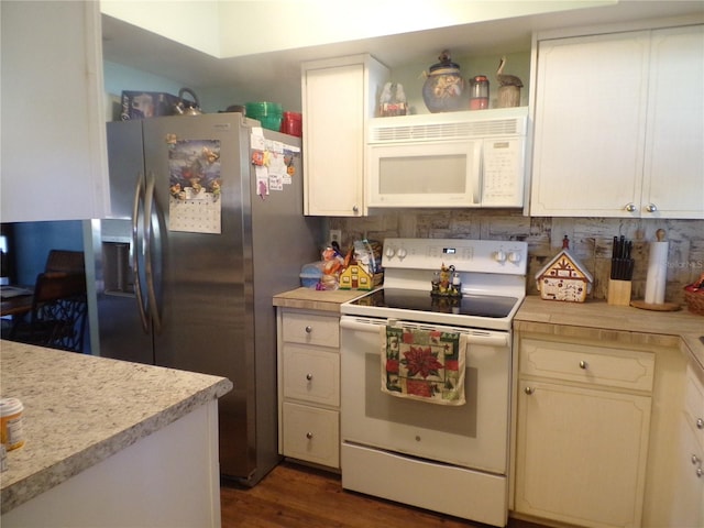 kitchen featuring white cabinets, dark hardwood / wood-style floors, decorative backsplash, and white appliances