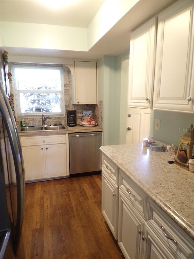 kitchen featuring white cabinets, dark hardwood / wood-style flooring, stainless steel appliances, and sink