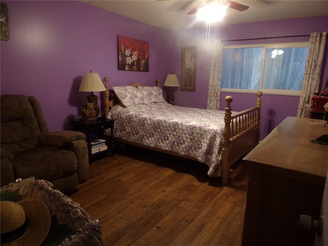 bedroom with wood-type flooring and ceiling fan