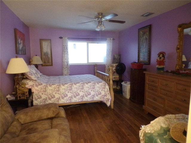 bedroom featuring dark hardwood / wood-style floors and ceiling fan