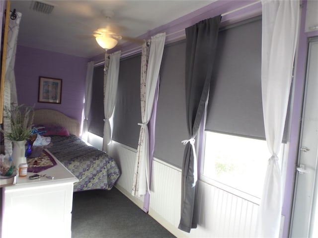 carpeted bedroom with ceiling fan