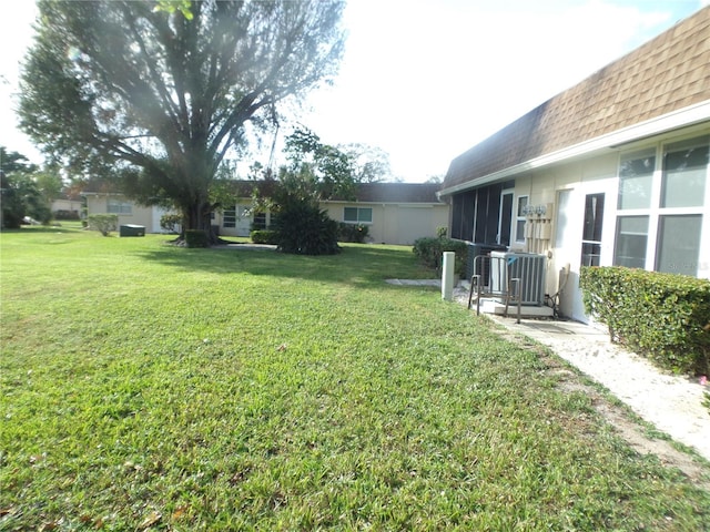 view of yard featuring central AC unit