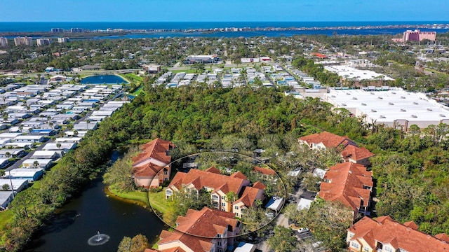 birds eye view of property featuring a water view